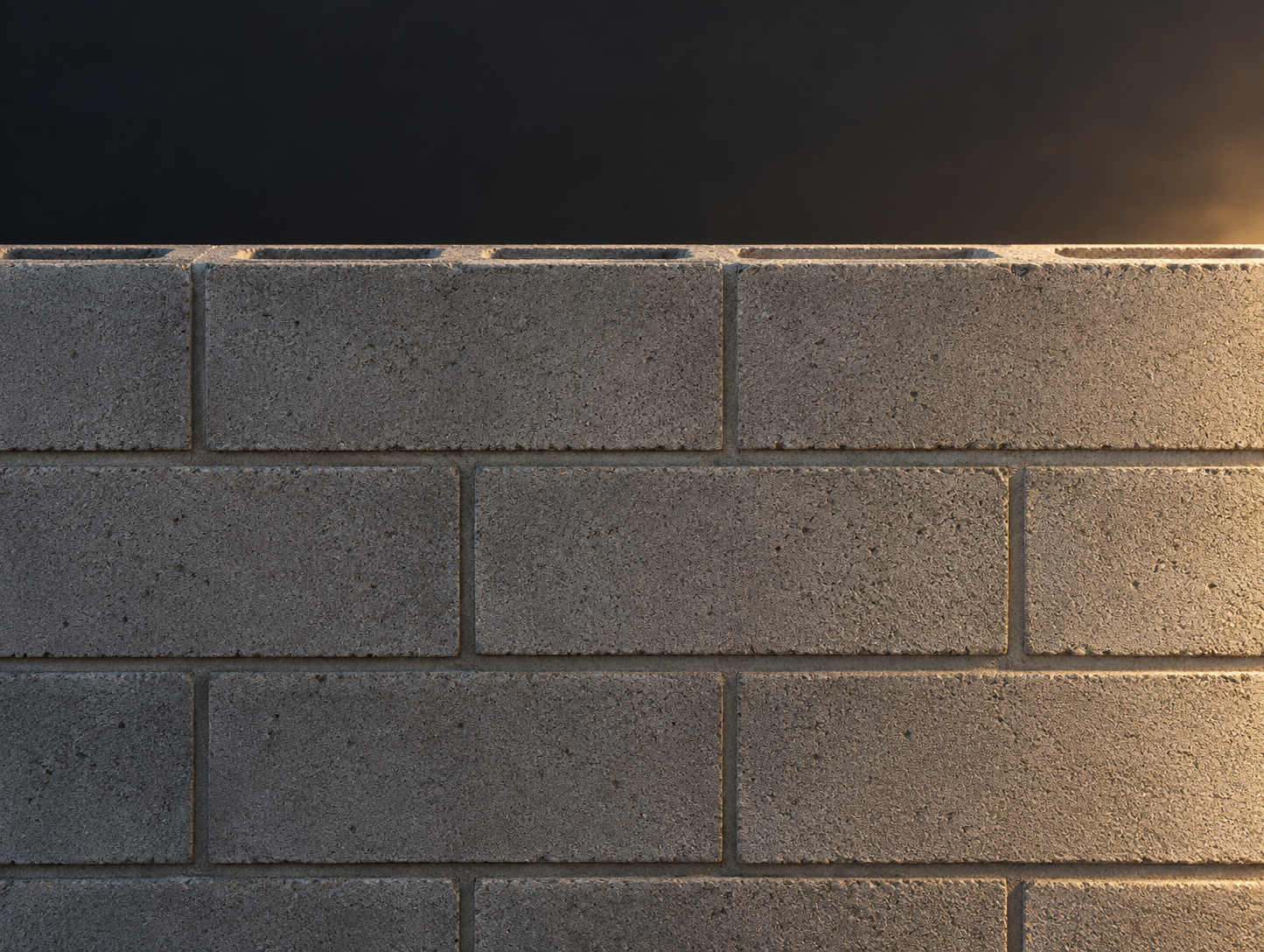 Muro de block terminado, juntas regulares, luz lateral cálida